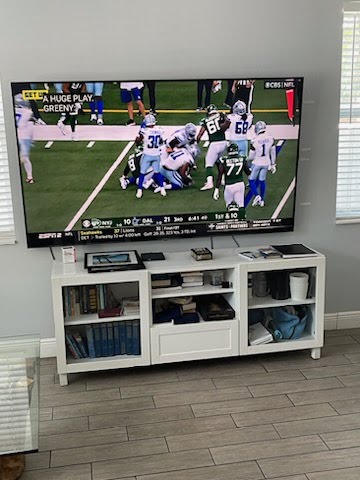 Football Game Being Displayed On Television