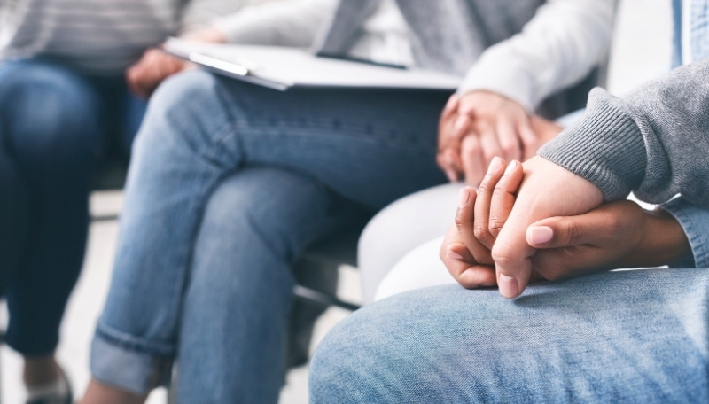 Two Individuals Holding Hands