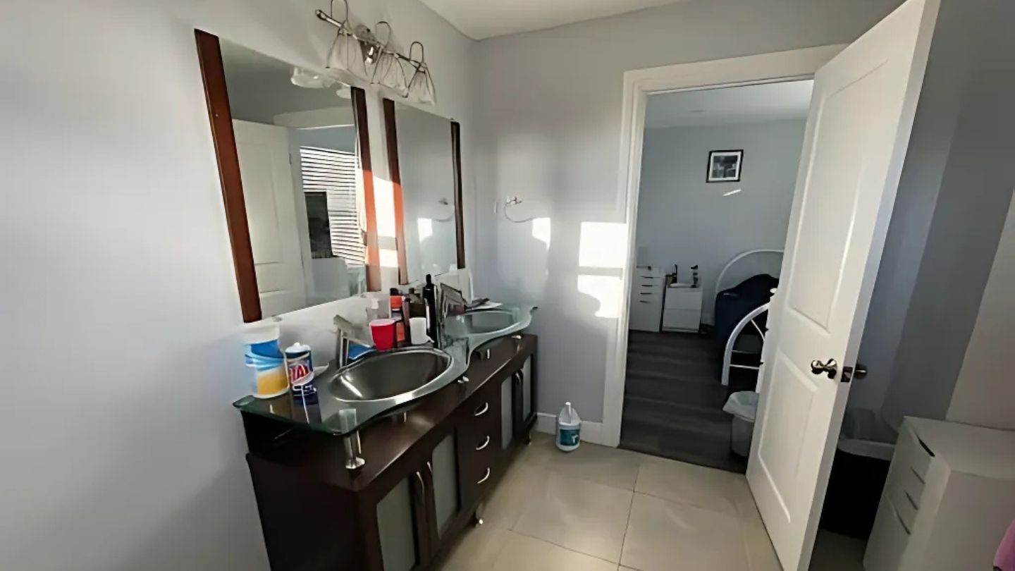 Modern Bathroom With Dual Sinks And Mirrors